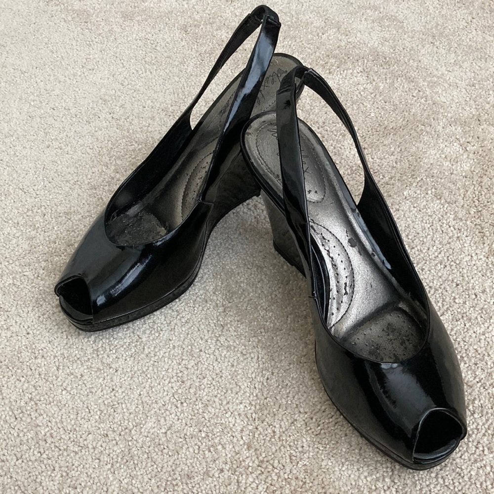 Black patent leather peep toe 4” wedges.